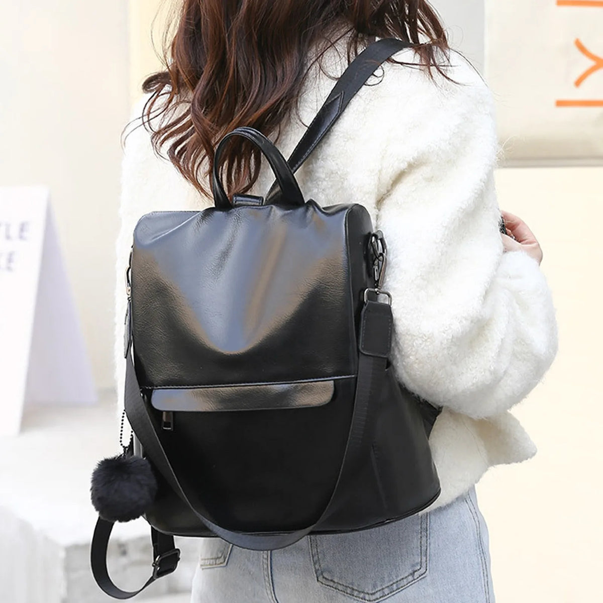 Photo of woman wearing a black minimalist korean backpack 